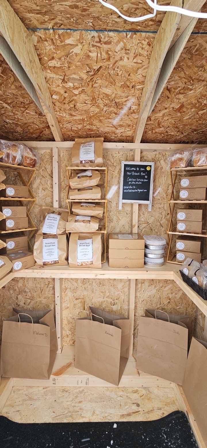 Inside the Wainfleet Bread Box shed — shelves stocked with fresh orders